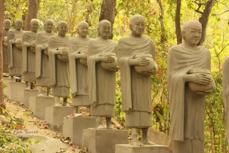 Statues Of Monks On Hill Path