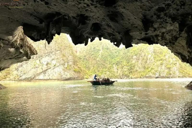 Rowing Boat Through Cave Halong